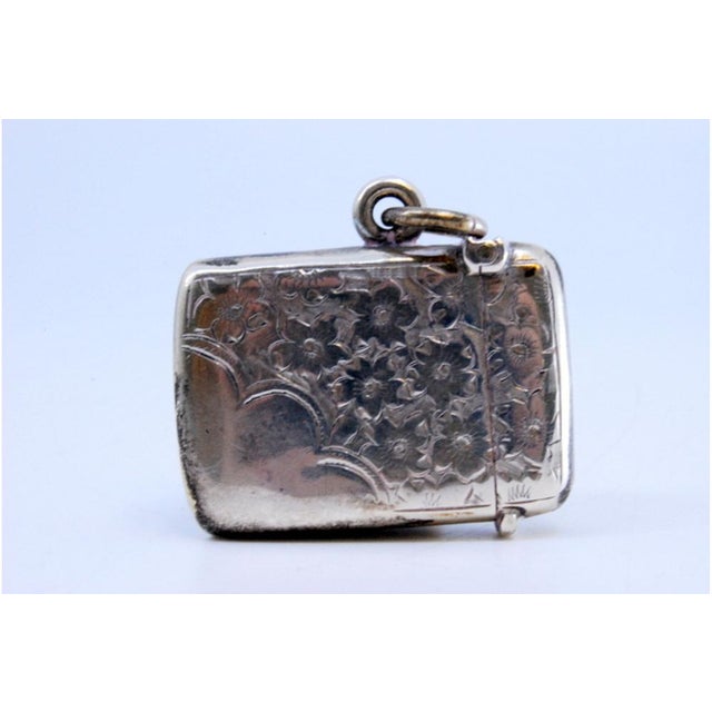 Victorian Silver Matchbox with Plant Motifs Surrounding Monogram Card and Suspension Ring, in Good conditions. Designed...