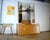 This is a beautifully designed mirrored chest of drawers from the 1970s. The veneer is oak. The chest features four...