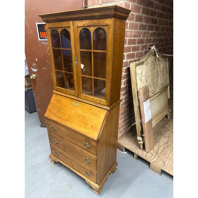 Antique English maple slant front two-piece secretary bookcase with double glass door upper section with two wood...