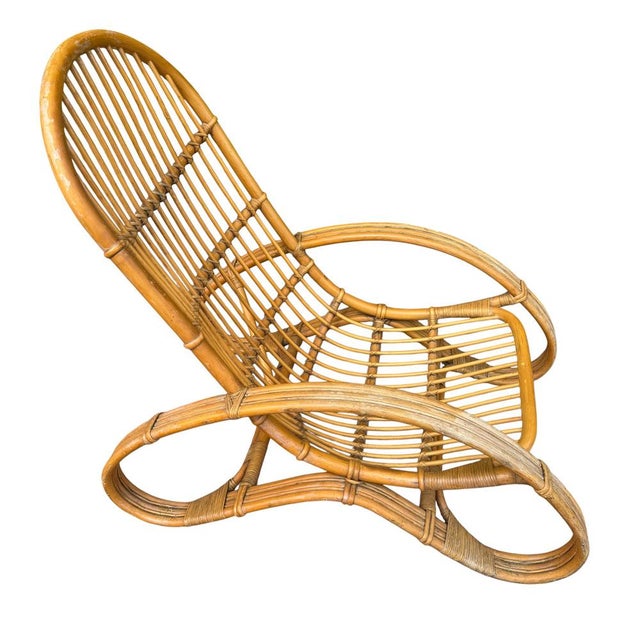 Lounge chair in bamboo and rattan, in the style of Roberti (Italy, founded in 1959), with a continuous backrest and seat,...