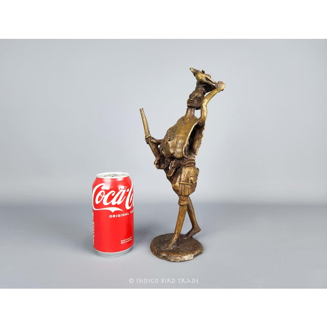 Antique African Tribal Hand Made Bronze Hunter Sculpture - Benin / Ashanti, c. early 20th century This extraordinary...