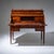 Louis XVI roll-top desk in mahogany, raised on tapered square legs with bronze sabots and fitted with five drawers beneath...