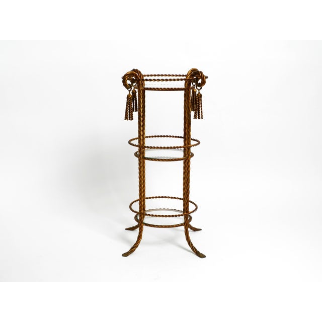 Very elegant, rare three layer Mid Century Regency side table made of gold-plated Metal. Manufacturer is Li Puma Firenze....