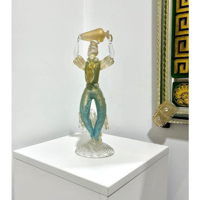 Very cute older piece of Murano Glass, featuring a server carrying an amphora of wine.