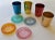 FUN! 8 Pieces of vintage Mid-Century Modern tableware: 4 anodized aluminum colored tumblers with 4 colored plastic...