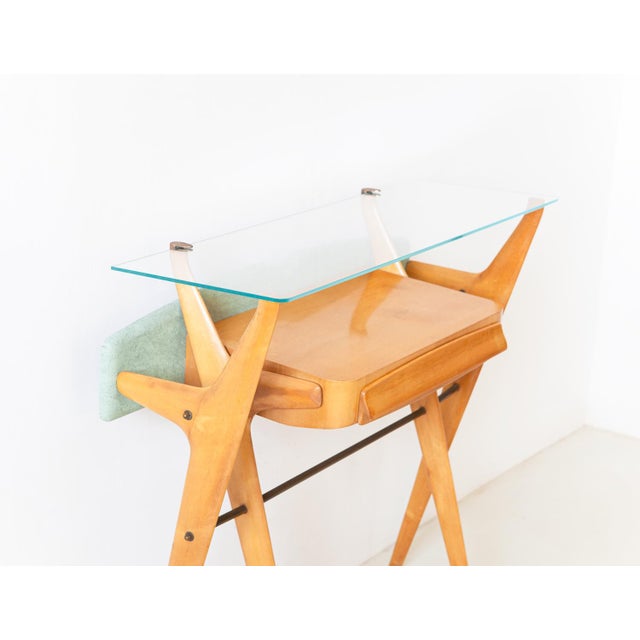 1950s Italian console A sculptural console table with drawer Made of maple with brass detail and glass top This incredible...