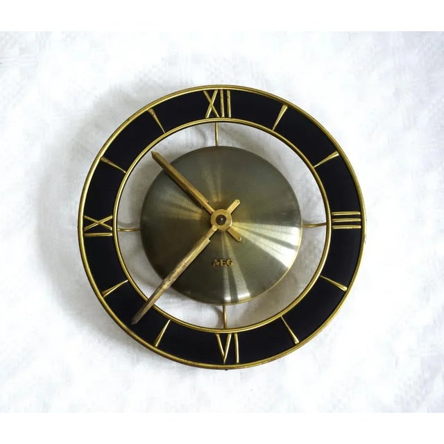Wall clock from aeg. works with 220 v ac. This piece has an attribution mark, i am sure that it is completely authentic...