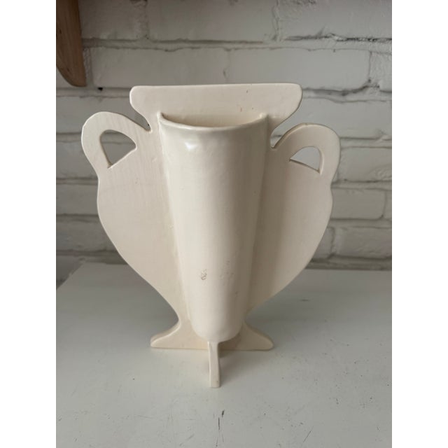 Bloomsbury inspired urn shaped silhouette vase with impressed garden leaves . Soft , romantic vase in cream colored clay...