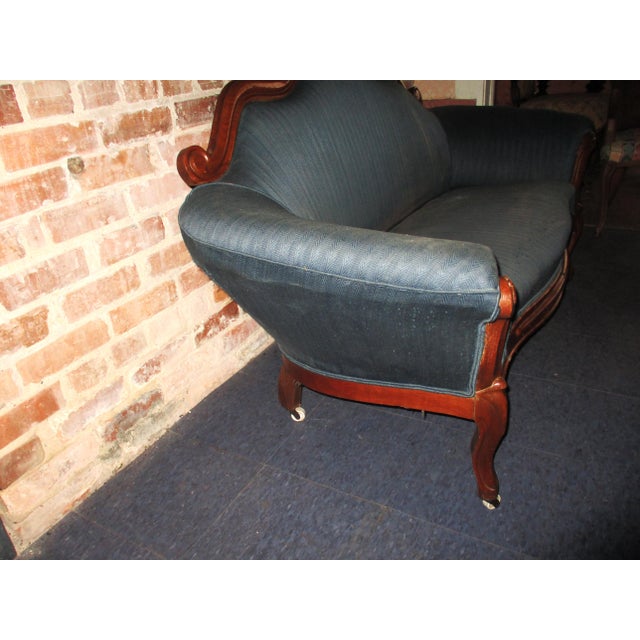 This is a Superb! Antique Victorian heavily carved walnut wood framed Loveseat / Sofa with a design of Grapes and Grape...