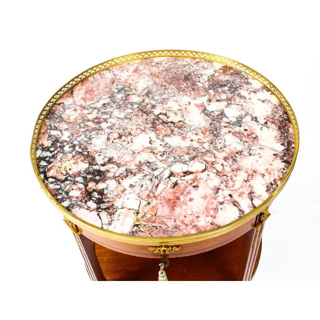 This is a beautiful antique French Louis Revival circular centre table with ornate ormolu decoration typical of the Louis...