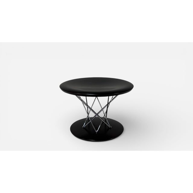 samu Noguchi iconic rocking stool in dark stained wood with polished chrome accents. Vitra production.