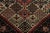 Hand-knotted in wool and originating circa 1910-1919, this 4x6 antique Persian rug features a bold floral medallion set...