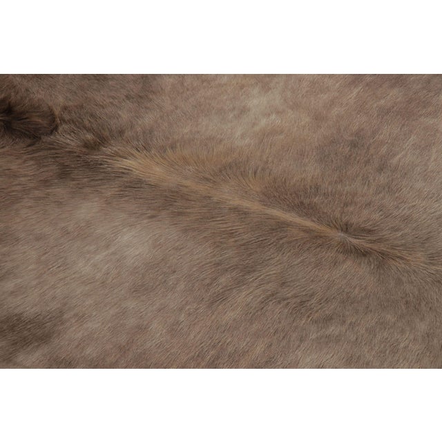 This handmade 7x8 contemporary cowhide rug from Rug & Kilim represents an exciting new collection of rare large-size...