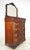 Victorian style bedroom dresser with a beveled mirror and deeply carved reliefs. It features the original brass hardware...