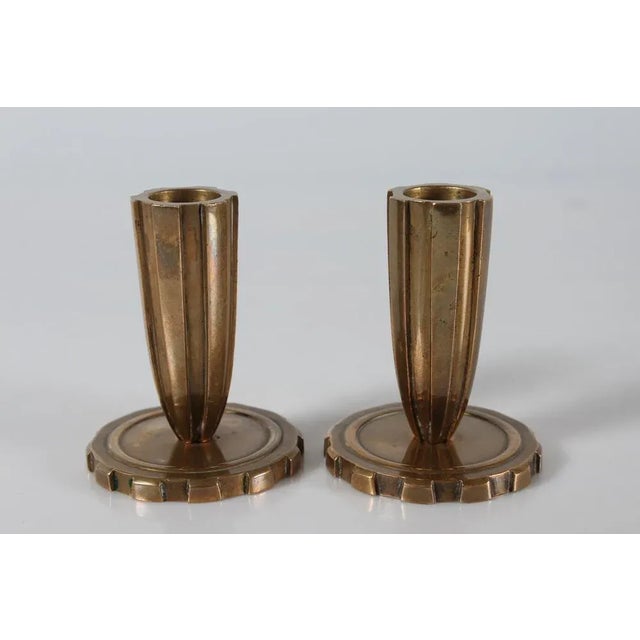A pair of Danish Art Deco candlestick made of solid bronze in fluted style Designed and made in Denmark 1930-1950. Very...