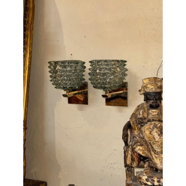 Pretty pair of Rostrada Murano glass and brass sconces. These glistening beauties are sure to make an impressive impact!...