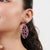 These captivating 14.05 carat natural ruby statement earrings are crafted in 925 sterling silver and feature a striking...