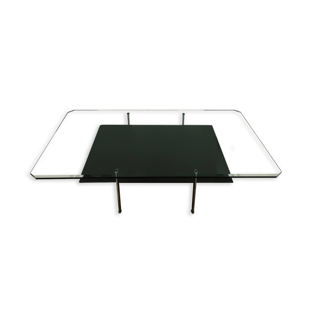 A "Diesis" coffee table by Antonio Citterio for B&B Italia. This modern Italian design by Citterio is a piece from his...