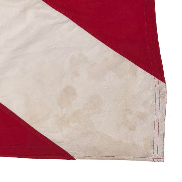This vintage signal flag has been modified to a different size and shape. Made from a cotton cloth with original staining...