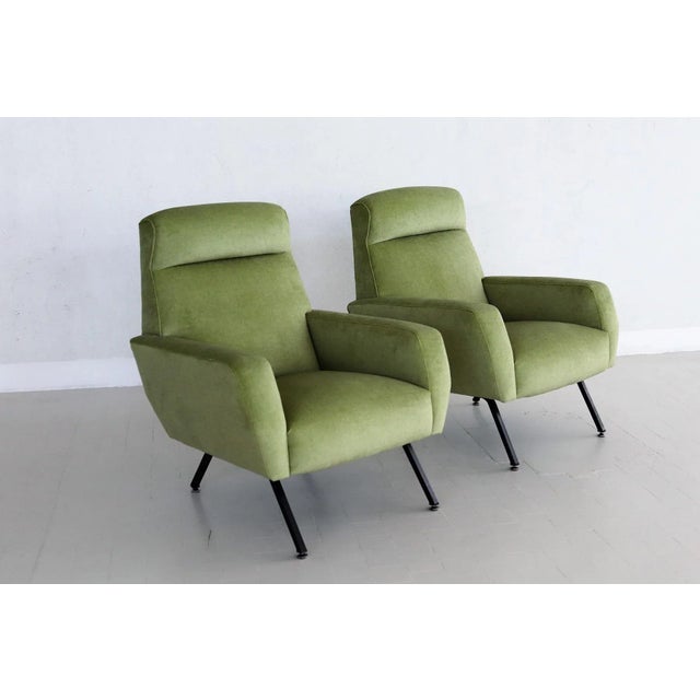 A set of two beautiful and very comfortable Italian Mid-Century armchairs or lounge chairs from the 1960s. The have been...