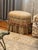 It features an oval silhouette wrapped in a muted Sage and Cream damask upholstery fabric with a coordinating vertical...