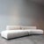 MDF Italia Cosy Curve Sofa with a cream fabric.