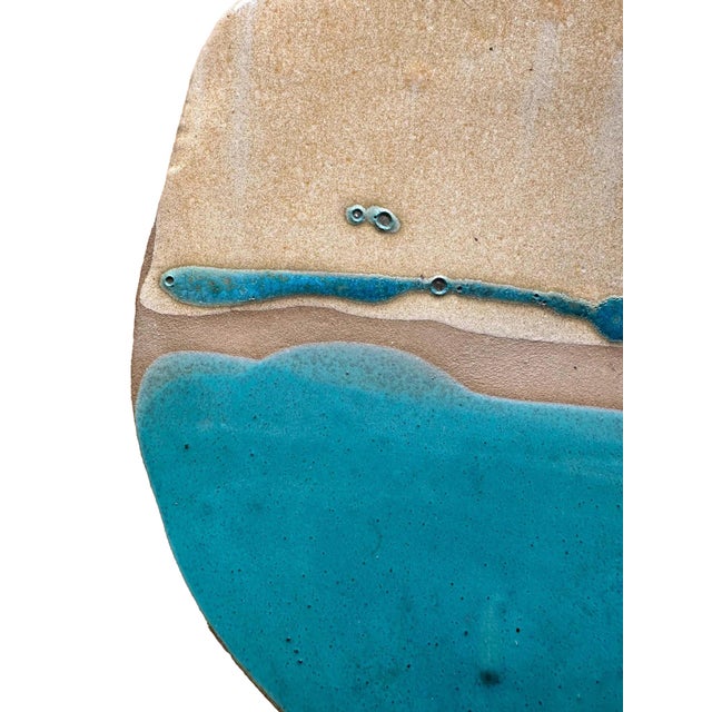 A large, rounded studio tray with abstract motifs in turquoise. A gently elevated rim, signed to the base. Holds a broad...