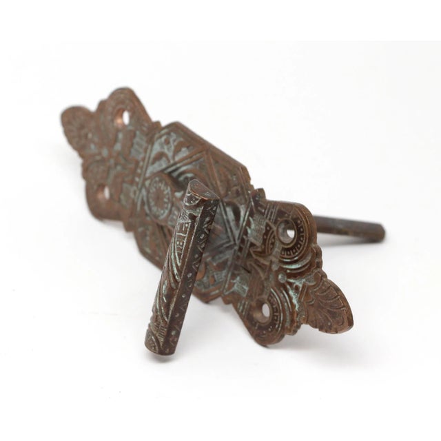 1880s Aesthetic style door bell lever pull made of bronze with a patina finish. The original mounting screws are not...