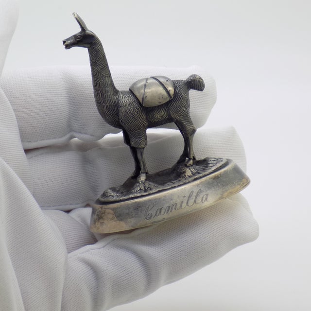 This sterling silver miniature depicts a classic Peruvian llama, capturing the traditional animalier heritage of South...