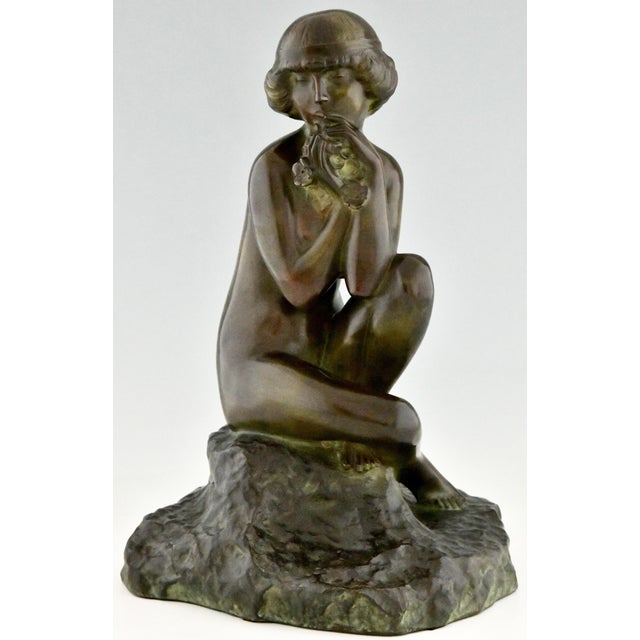 Art Deco bronze sculpture seated nude with flowers by Maxime Real del Sarte, France 1888-1954. Ca. 1920. “Bronzes,...