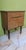 Beautiful wood veneer nightstand, vintage 1950s style. It has an elegant and timeless design. - One drawer and a drop-down...