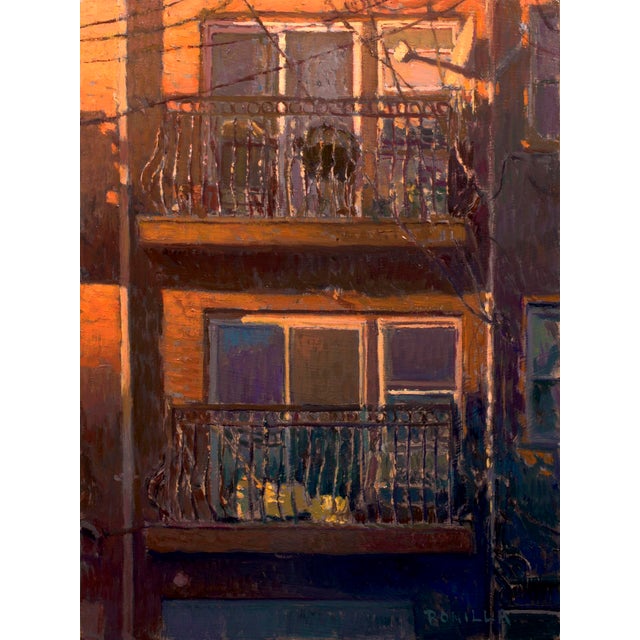 The painting depicts a warm, sunlit balcony with intricate wrought iron railings, capturing the intimate atmosphere of a...