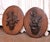 This distinctive pair of antique Black Forest wall plaques was hand-carved from solid walnut in France circa 1870. Each is...