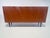 This elegant mid-century sideboard comes from the renowned german furniture manufacturer heinrich riestenpatt kg...