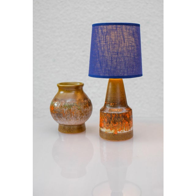 A striking 1970s ceramic lamp base by Tilgmans, Sweden, showcasing the studio’s distinctive use of bold patterning and...