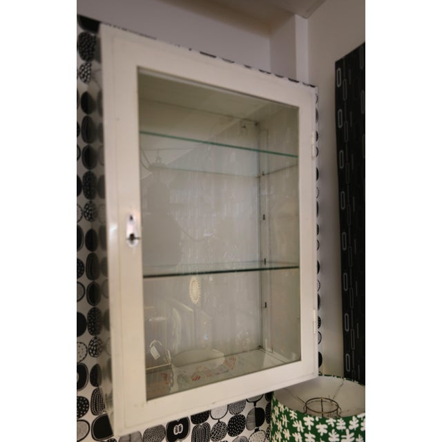 Wall-mounted doctor's cabinet in sheet metal and glass, the absolute perfect cabinet for displaying the finery of your...