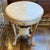 Kreiss Empire Stone Top Side Table A travertine top sits upon a pickled wood base culminating with four paw feet. A single...
