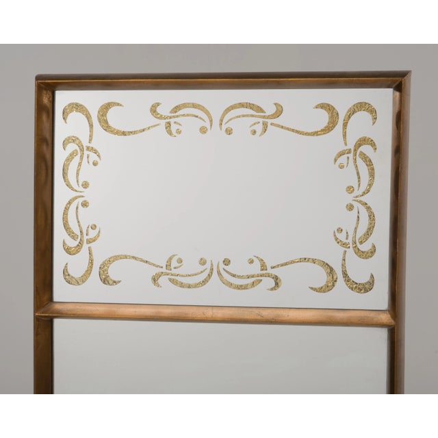 An Italian gilt eglomise mirror from the 1950s. Actual depth of the frame is 2", it is 2.2" with the wire support. The top...