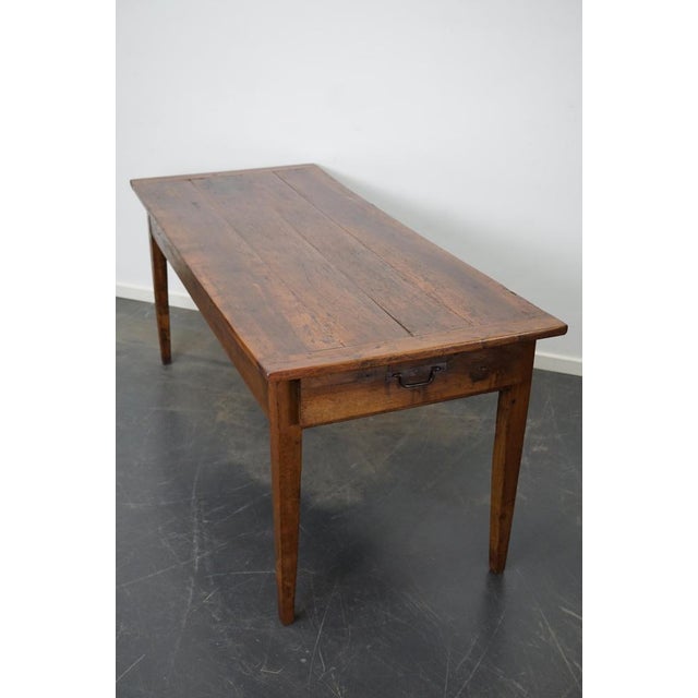 This elegant table was made in Southern France in the mid 19th century. It has a tabletop made from fruitwood. The table...