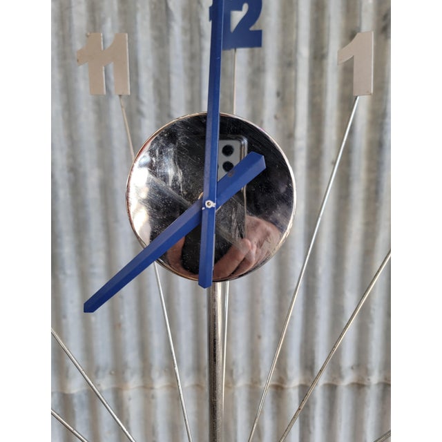 Bizarre floor clock inspired by the starburst, sunburst style of the 1960's & 70's. Chrome plated steel with painted...