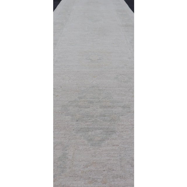 Modern Hand-Knotted Oushak Runner With Medallion Design on a Cream Field With Blues For Sale - Image 3 of 12