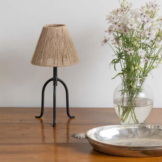 Petite iron tripod lamp with slender legs and tapered feet. New wiring and new rope shade. Sold individually and newly...