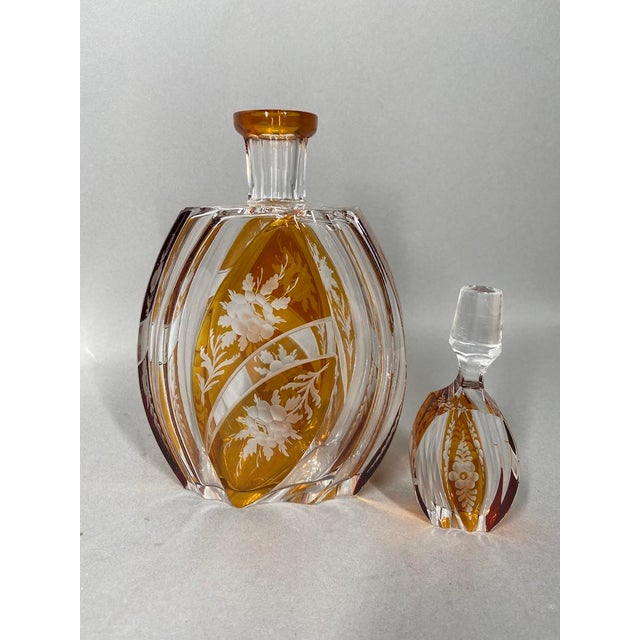 This elegant 19th-century Bohemian crystal decanter combines clear cut crystal with warm amber-colored panels and delicate...