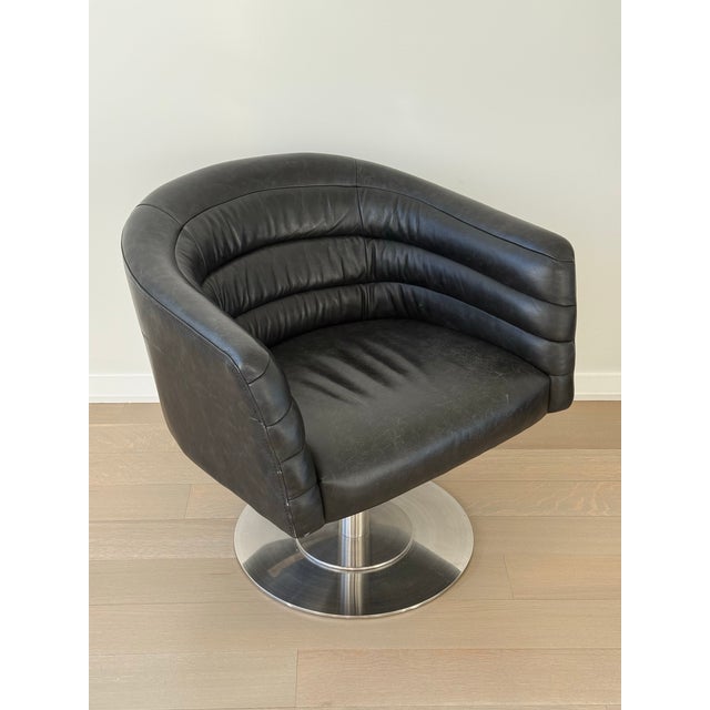 Selling my authentic CB2 Cupa Swivel Chair in black leather. This style is sold out and rarely available. 100% top-grain...