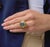 This bold vintage cocktail ring showcases a striking oval cut aquamarine weighing approximately 14.00 carats, radiating a...