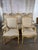 An exceptional set of fourteen French Louis XV style dining chairs, including twelve side chairs and two armchairs,...