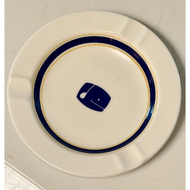 This ceramic catchall ashtray, made of vitrified hotel ware, known for high durability and scratch resistance, was...