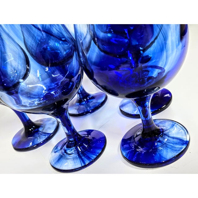 Deepest ocean cobalt blue swirls inside these hurricanes like a jet of ink left by a startled octopus. The vivid blue...