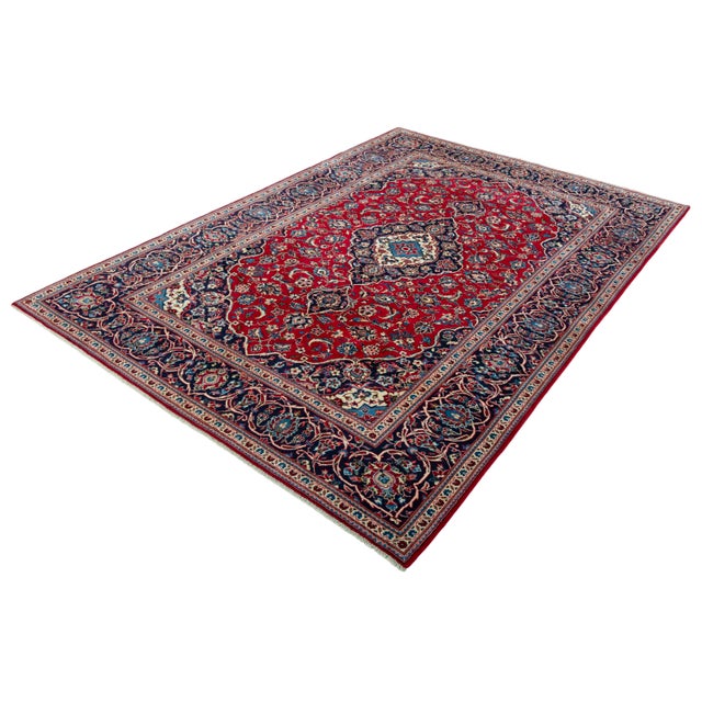 This magnificent Kashan cork rug in a classic medallion composition impresses with its masterful craftsmanship and...