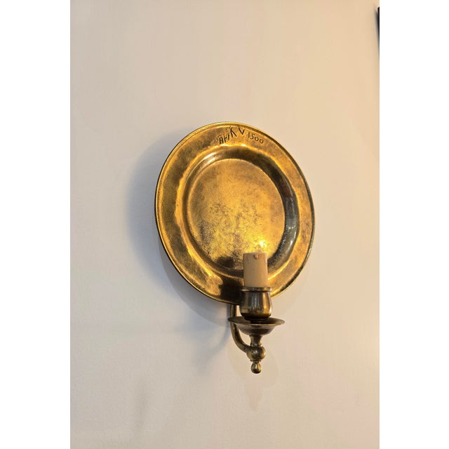 Pair of vintage wall sconces by Ari KV 1500, crafted in bronze. Their clean design features a wide circular base and a...